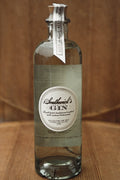 Stand alone bottle of Southwick's American Gin on a wood background - hand crafted in Connecticut.