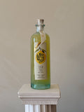 Bottle of 'Veritable Limoncello' on a white pedestal against a beige background