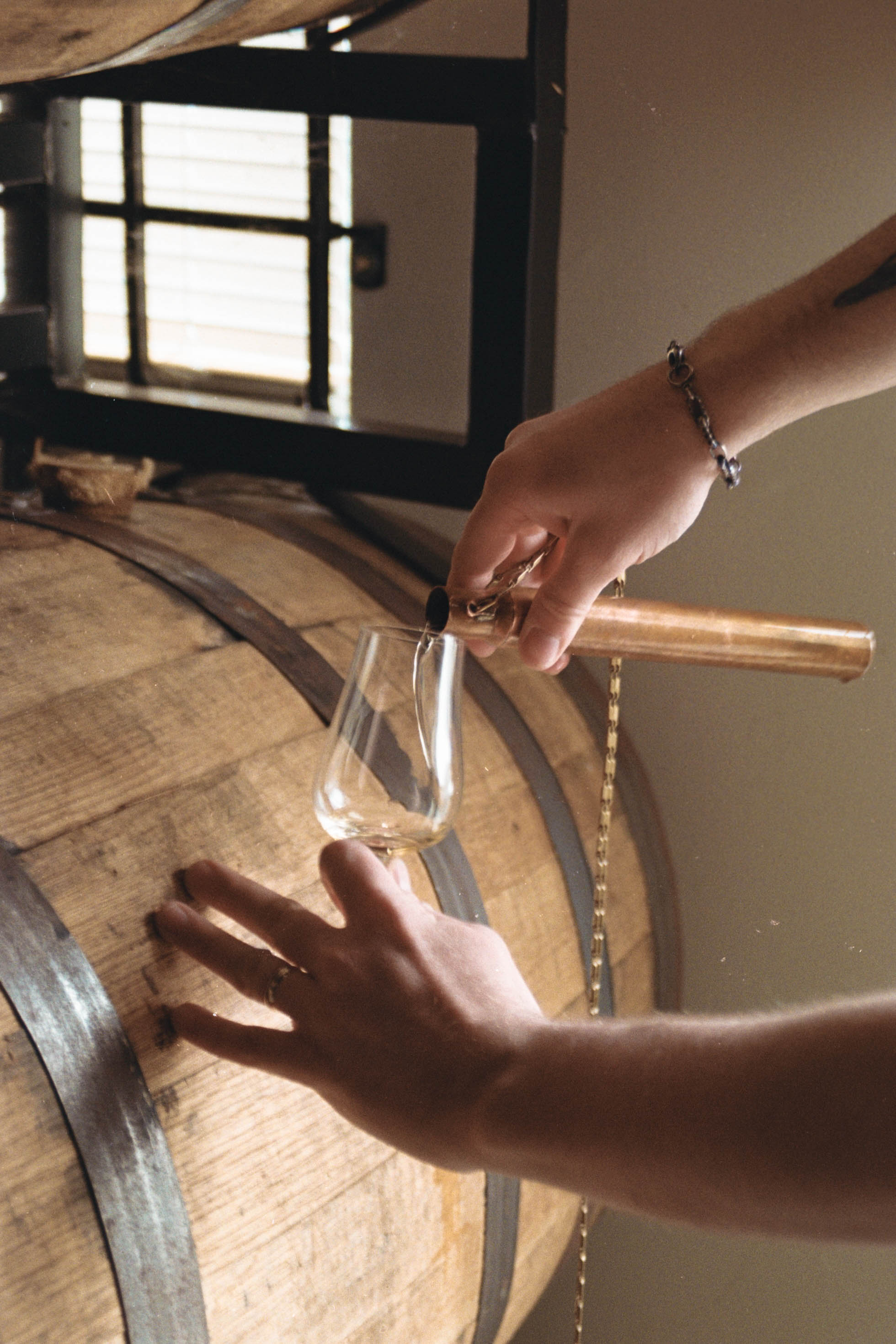 imaged of someone pour a sample fresh from the cask of aged american single malt